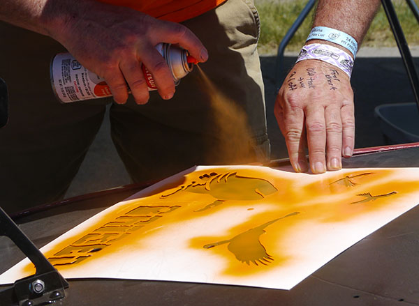 Judge Steve McDaniel spraying a BRIBED stencil at the 2015 Buttonwillow race